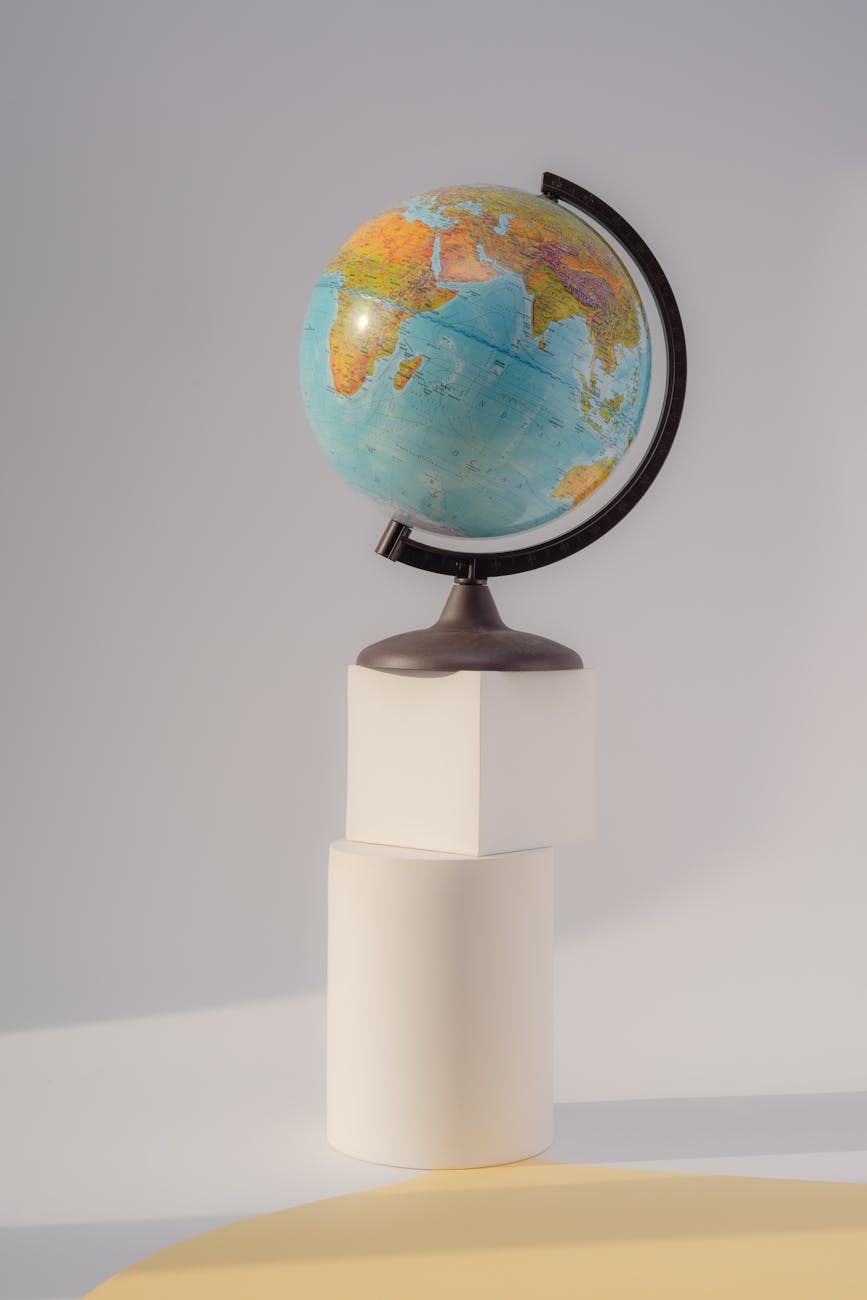 a globe over a white box